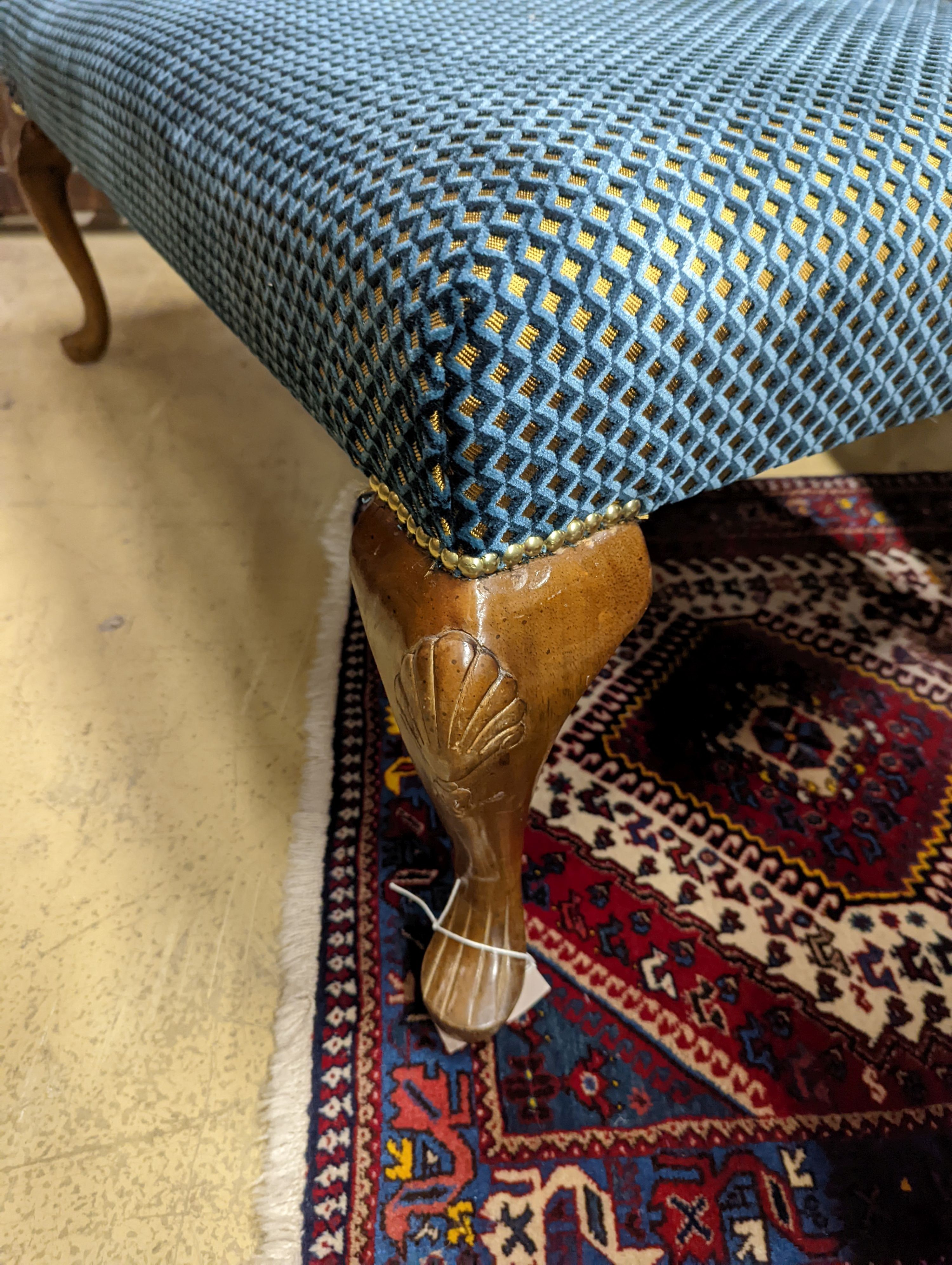 An upholstered footstool. W-117cm, D-73cm, H-44cm.